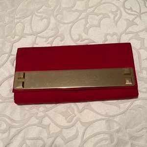 Red velevet clutch with gold detail and chain